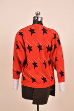 Load image into Gallery viewer, Red Shooting Star Print Sweater as shown from the back
