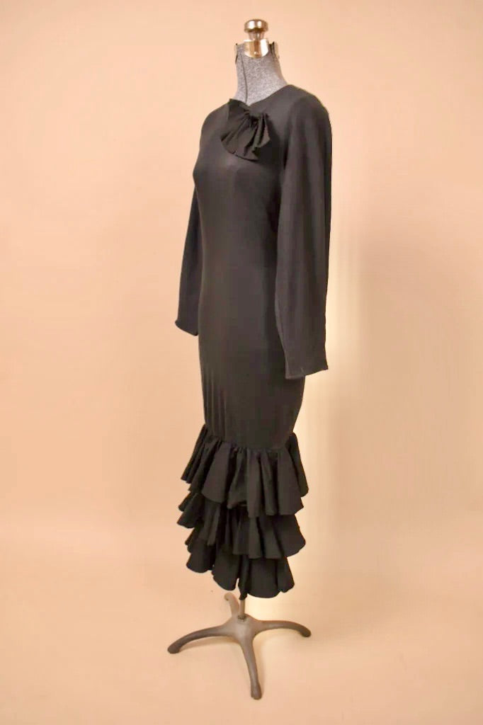 Black Cotton Ruffle Maxi Dress by Arpeja pictured from the side.