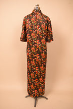 Load image into Gallery viewer, Psychedelic christmas floral maxi dress shown from the back
