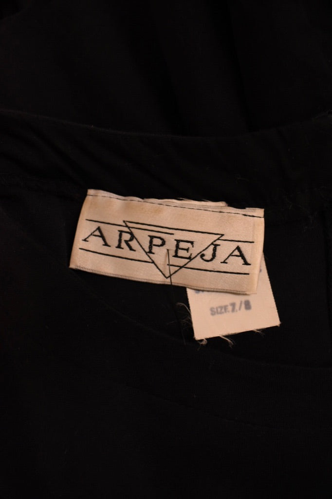 Black Cotton Ruffle Maxi Dress by Arpeja. Close up of the tag.