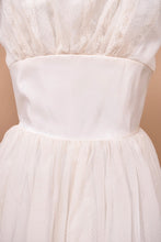 Load image into Gallery viewer, Vintage fifties white tulle ball gown is shown in close up. This gown has a structured bodice.
