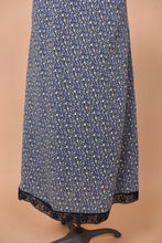 Load image into Gallery viewer, Vintage 90&#39;s navy lace trim maxi is shown in close up. This dress has a navy blue and white calico floral print.
