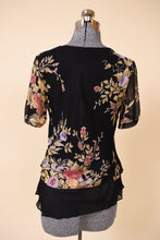 Load image into Gallery viewer, Vintage nineties black bias cut double layer sheer top is shown from the back. This top has a floral design. 

