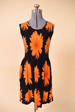 Load image into Gallery viewer, Vintage Y2K black and orange smocked sundress is shown in close up. This dress has a scooped neck.
