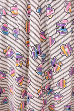 Load image into Gallery viewer, Vintage novelty print colorful handmade midi length dress is shown in close up.
