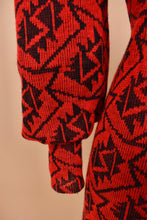 Load image into Gallery viewer, Vintage 80&#39;s red and black patterned dress by Pea Patch is shown in close up. This dress has wide balloon sleeves.
