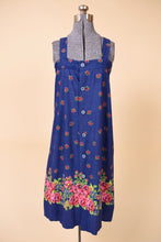 Load image into Gallery viewer, Vintage 60&#39;s royal blue floral pattern tent sundress is shown from the front. This dress has buttons down the front. 
