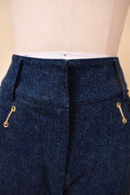 Load image into Gallery viewer, Vintage Y2K navy bell bottom leg jeans are shown in close up. These jeans have tiny gold chains on the hips. 

