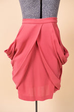 Load image into Gallery viewer, Vintage Y2K designer pink rosebud draped skirt by Miu Miu is shown from the front. This skirt has a mini pencil silhouette with flowy draping. 
