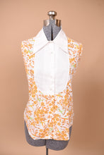 Load image into Gallery viewer, Vintage 1960&#39;s orange floral bird print is shown from the front. This shirt buttons up the front.
