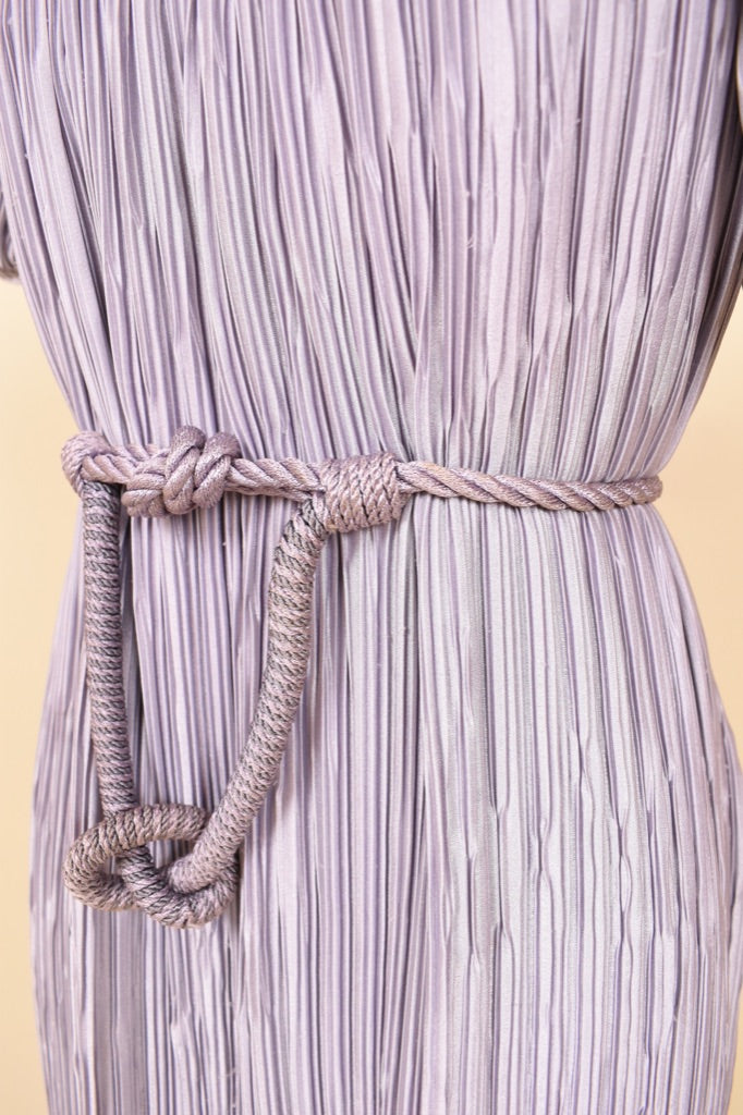 Vintage 1980's Pierre Labiche lavender micropleat dress is shown in close up. This textured pastel dress has a braided rope belt. 