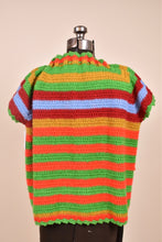 Load image into Gallery viewer, Vintage seventies brightly colored striped knit cardigan is shown from the back. This rainbow knit shrug cardigan has a drawstring neckline.
