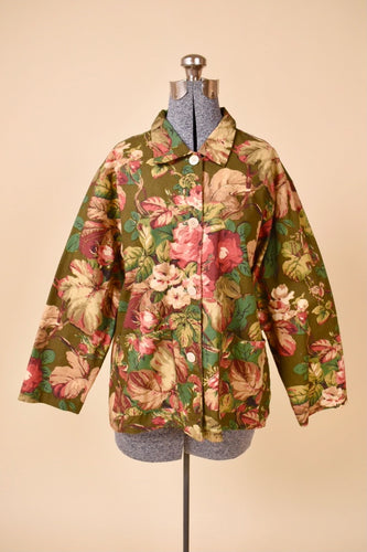 Vintage olive green cotton floral print jacket by Outside Designworks is shown from the front. This collared jacket has buttons down the front. 