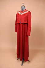 Load image into Gallery viewer, Vintage seventies red maxi dress by Lanz is shown from the side. This dress has a matching bolero jacket with a floral yoke detail.
