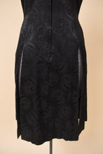 Load image into Gallery viewer, Vintage black silk jacquard swirl print tunic is shown from the back. This dress has two high slits up the back. 
