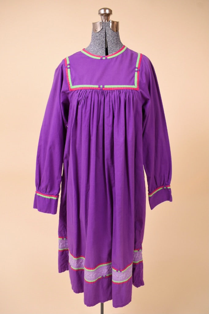 Vintage 1970s purple cotton tunic dress by Karavan is shown from the front. This dress has long sleeves.