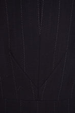 Load image into Gallery viewer, Vintage black and white pinstripe blazer is shown in close up. This blazer is black with white pinstripes. 
