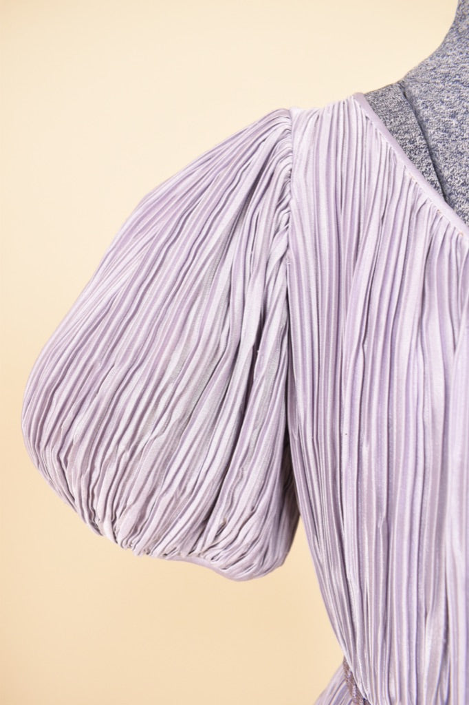 Vintage 80's pastel purple Pierre Labiche midi dress is shown in close up. This dress has puff sleeves. 
