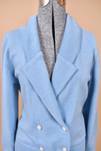 Load image into Gallery viewer, Vintage seventies two piece baby blue wool sweater set is shown in close up. This sweater has a foldover collar with a deep v neckline. 
