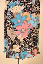 Load image into Gallery viewer, Vintage floral print rayon ruffled midi length dress is shown in close up. 
