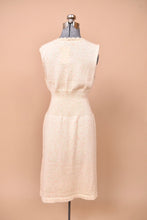Load image into Gallery viewer, The back of the dress has a continuation of the front pattern.
