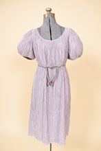 Load image into Gallery viewer, Vintage 1980&#39;s lilac purple Pierre Labiche micropleat puff sleeve dress is shown from the front. This dress has a rope belt that ties around the waist. 
