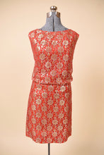 Load image into Gallery viewer, Vintage 1960&#39;s red metallic lace party dress by Algo is shown from the front. This dress has a gold lace overlay. 
