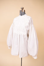 Load image into Gallery viewer, Vintage embroidered folksy 70&#39;s puff sleeve poet blouse is shown from the side. 
