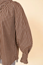 Load image into Gallery viewer, Vintage brown and white Young Victorian seventies blouse is shown in close up. This blouse has wide puffy mutton sleeves. 
