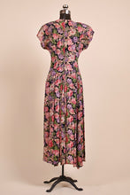 Load image into Gallery viewer, Vintage 90&#39;s floral dress by Carole Little is shown from the back. This dress has a full pleated skirt. 
