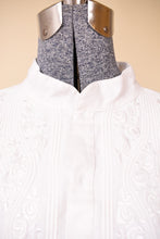 Load image into Gallery viewer, Vintage seventies romantic white embroidered cotton blouse is shown in close up. 
