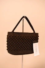Load image into Gallery viewer, Vintage woven crocheted black silk corde handbag is shown from the back.
