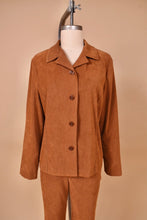 Load image into Gallery viewer, Vintage brown faux suede two piece blazer and pants set is shown in close up. The blazer has brown buttons down the front.
