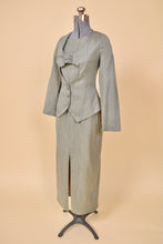 Load image into Gallery viewer, Vintage green 1990&#39;s two piece set by Zoom is shown from the side. This nineties power suit has a blazer with a keyhole cutout at the bust. 
