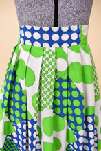 Load image into Gallery viewer, Vintage 60s bright green and blue polka dot maxi length skirt is shown in close up. 
