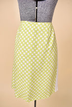 Load image into Gallery viewer, Vintage Y2K lime green and white checkered print silk skirt by Versace is shown from the back. This skirt has a white stripe down the side. 
