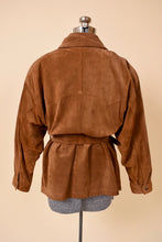 Load image into Gallery viewer, Vintage eighties brown suede belted jacket is shown from the back. This jacket has a western style double pointed yoke stitching at the back of the shoulders. 
