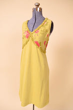 Load image into Gallery viewer, Vintage lime green  usa made floral linen midi dress is shown from the side. This dress has a pink rose print on the bust. 
