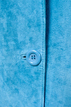 Load image into Gallery viewer, Vintage 90&#39;s turquoise blue suede jacket is shown in close up. This jacket has three blue plastic buttons down the front. 
