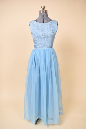 Vintage powder blue handmade princess maxi gown is shown from the front. This dress has a brocade floral print bodice. 