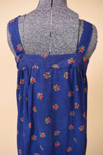 Load image into Gallery viewer, Vintage seventies tent style cotton floral print sundress is shown in close up. 
