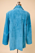 Load image into Gallery viewer, Vintage 1990s blue suede blazer is shown from the back. This collared colorful suede jacket has a patchwork design. 
