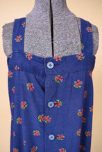Load image into Gallery viewer, Vintage 70s blue and pink floral print sundress is shown in close up. This dress has blue buttons down the front. 
