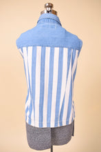 Load image into Gallery viewer, Vintage 1990&#39;s white and blue stripe denim button down top is shown from the back. This top by Pret&#39;e is a vest style. 
