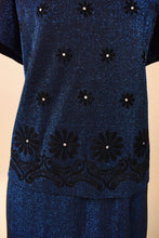 Load image into Gallery viewer, Vintage two piece sparkly navy lurex set is shown in close up. This set has a black velvet navy applique print with rhinestones. 
