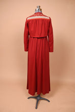 Load image into Gallery viewer, Vintage 1970&#39;s maxi dress and bolero jacket set by Lanz is shown from the back. This set is red with a white floral trim on the bolero jacket.
