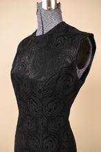 Load image into Gallery viewer, Vintage swirl print 60&#39;s black shift dress is shown in close up. This tunic dress is sleeveless. 
