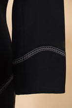 Load image into Gallery viewer, Vintage Escada minimalist black chic suit set is shown in close up. This suit has white western stitching at the hems.
