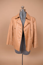 Load image into Gallery viewer, Vintage beige double breasted Cole Haan leather jacket is shown from the front. This jacket is lined. 
