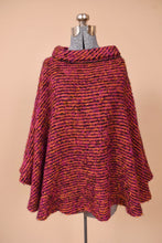 Load image into Gallery viewer, Vintage pink woven boucle cape is shown from the front. This Irish wool cape has a turtleneck.
